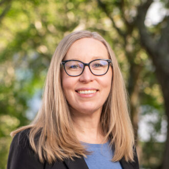 Scientist wearing glasses and smiling